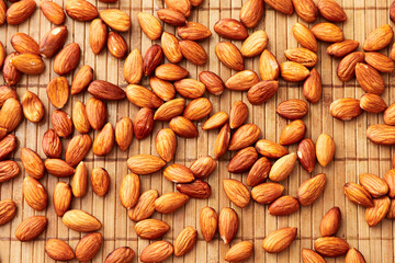 Almonds on a wooden surface.