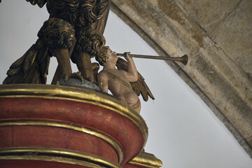 wooden statue on the baroque pipe organ of the 18th century inside the Monastery of Santa Cruz in...
