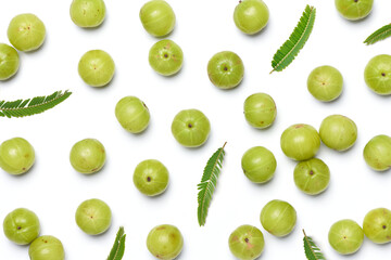 Flat lay of Fresh Amla (Indian gooseberry) fruits on white background.