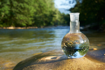 Flask with clear river water.
