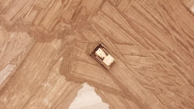 Aerial view of a excavator in the mine. Use drones to inspect of your business. Drone air shot.