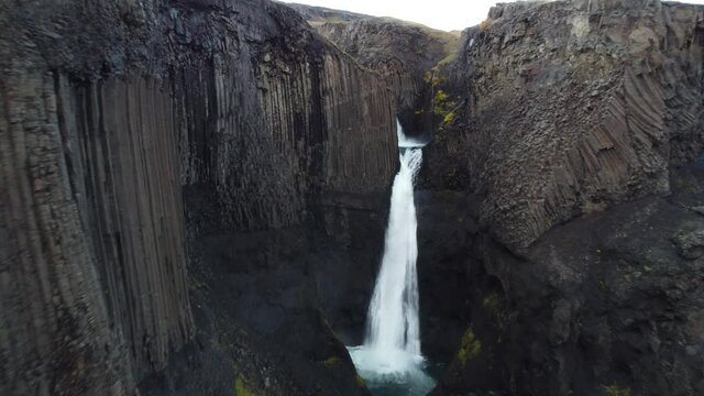 Approaching flight to basaltic waterfall in Iceland