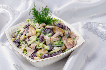Russian Salad with beans and ham on Retro Ceramic Plate. close up