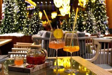 Fototapeta na wymiar cocktail glasses on festive table in restaurant. drink alcohol for a holiday