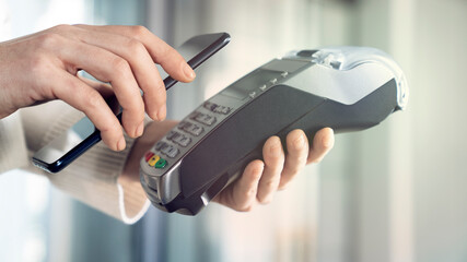 Customer paying with NFC technology