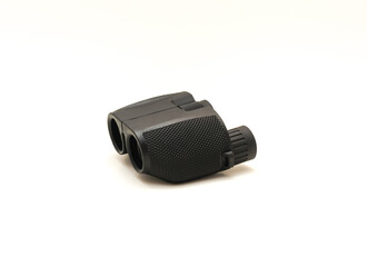 Side view a black compact Binoculars with rubber armor ergonomic steady grip isolated on white