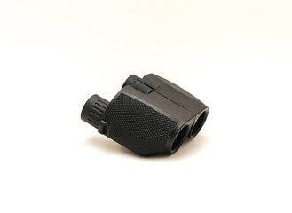 Side view a black compact Binoculars with rubber armor ergonomic steady grip isolated on white