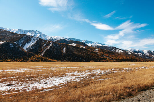 High cliffs in the mountains with snow on the peaks in Altai