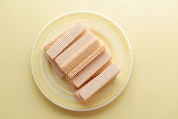 top view of wafer roll chocolate on a plate 