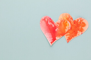 Cut the heart shaped paper, put on a pastel background.