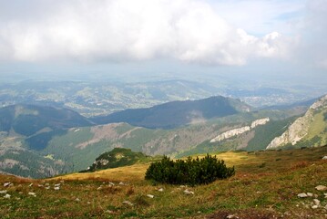 Naklejka na ściany i meble Beautiful mountain landscape. A trail leading through the Tatra National Park.