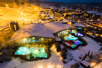 Drone View of Bania Thermal Baths at Winter Night. Zakopane, Poland - obrazy, fototapety, plakaty