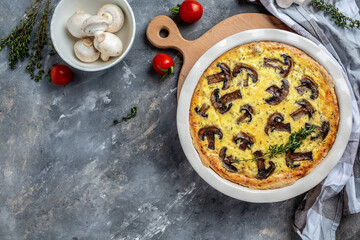 Mushroom Quiche Pie with champignons and cheese. Savory tart with mushrooms. Traditional french pie Quiche Lorraine. banner, menu recipe place for text, top view