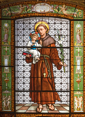ROME, ITALY - AUGUST 30, 2021: The St. Anthony of Padua in the stained glass in the church Sant'Antonio dei Portoghesi.