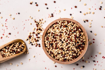 Sets quinoa seeds on a wooden bowl. Healthy and diet superfood product. Long banner format, top view