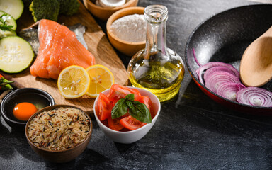 Fresh food ingredients prepared for cooking on a kitchen table