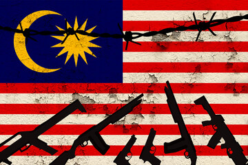 national flag of Malaysia on the wall with cracks, barbed wire, drawing of a weapon, the concept of...