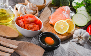 Fresh food ingredients prepared for cooking on a kitchen table