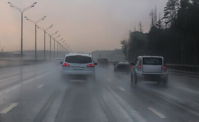 Traffic in heavy rain on highway.
