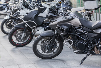 Fototapeta na wymiar Motorbikes in a parking lot on city street