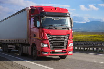 Fototapeta na wymiar Truck driving on a suburban highway