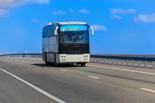 Tourist Bus Moves Along Suburban Highway
