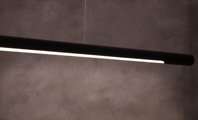 Close-up LED lamp on a concrete wall. LED lamp black background