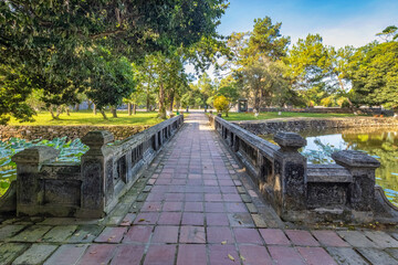 Minh Mang tomb near the Imperial City with the Purple Forbidden City within the Citadel in Hue, Vietnam. Imperial Royal Palace of Nguyen dynasty in Hue. Hue is a popular 