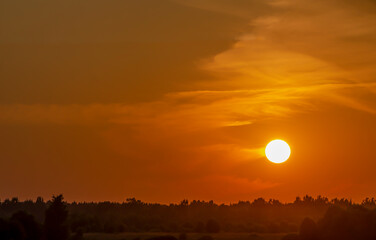 Bright orange sunset over the Velikaya River, Russia