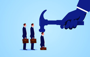 Businessman hits the hammer of the big hand into the ground