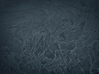 Textured black grunge background.