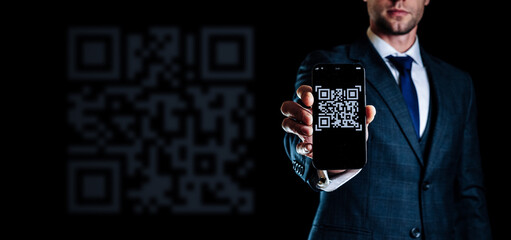 Qr pay. Digital mobile smart phone with qr code scanner on smartphone screen for payment, online pay, scan barcode on black background. Business and technology concept.