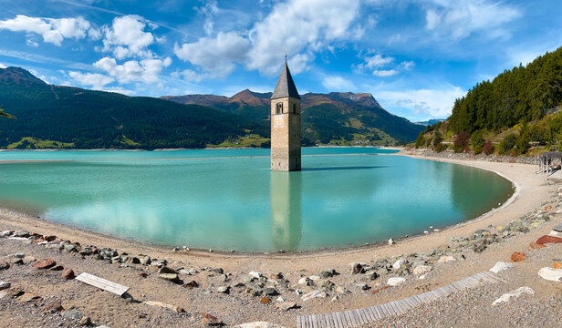 Bell tower out of flooded village Graun - Curon in Tyrol, Italy