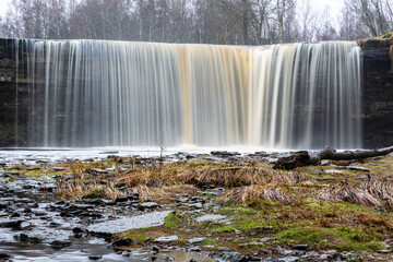Jegala waterfall on a gray winter day without snow and ice