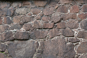 the texture of the finishing stone on the wall. Natural stone.