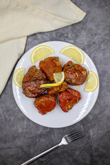 Dried stuffed peppers on a dark background. Rice stuffed sundried red pepper. Turkish cuisine appetizers. Kuru biber dolması. Top view. close up