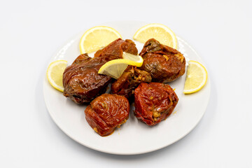 Dried stuffed peppers on a white background. Rice stuffed sundried red pepper. Turkish cuisine appetizers. Kuru biber dolması. Horizontal view. close up