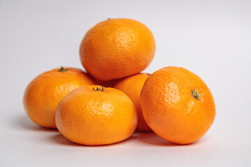 Several tangerines on a blue background.