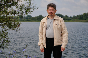 Fototapeta premium Fishing on the lake. Photo before going home. Recreation center. August 2021.