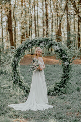 Wedding arch. Beautiful bride.