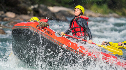 Girl and heavy water splash in river rafting expedition. High speed sports photography. Sport portrait.