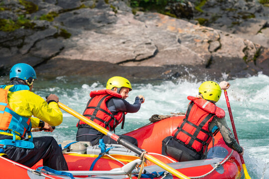 Two girls are padling in extreme river. Happiness and water sports concept.