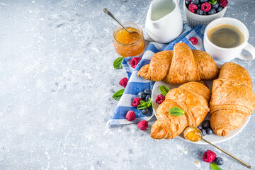 Sweet breakfast croissants with jam and berries