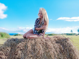 girl on the manger in summer