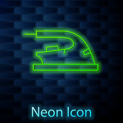 Glowing neon line Electric iron icon isolated on brick wall background. Steam iron. Vector