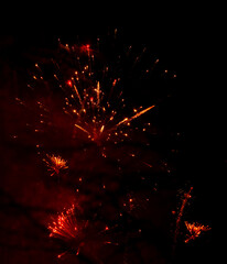 Fototapeta na wymiar Abstrakte Funken von einem Silvester Feuerwerk für Hintergründe
