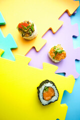 sushi rolls on a color background, minimalism