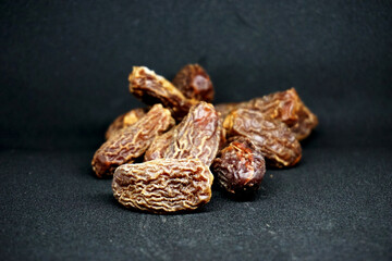 delicious dried dates with black background