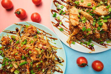 noodle and sushi rolls on a color background, minimalism