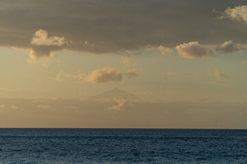 Peak of Teide, tallest mountain of Spain, peaking through the clouds above Tenerife